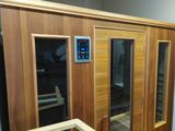 an image of a sauna room with a glass door