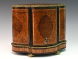 a small wooden box with a decorative design on it