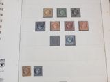 a lot of stamps on the pages of a book