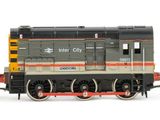 three toy trains sitting next to each other on a white surface