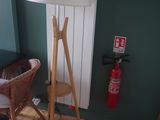 a lamp that is on a wooden stand in a room