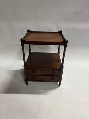 a small wooden table with two drawers and a drawer underneath it