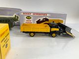 two toy trucks and a box of boxes on a table