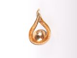 an image of a gold tear shaped pendant with a diamond in the center