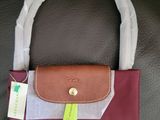 longchamp purse in burgundy and tan
