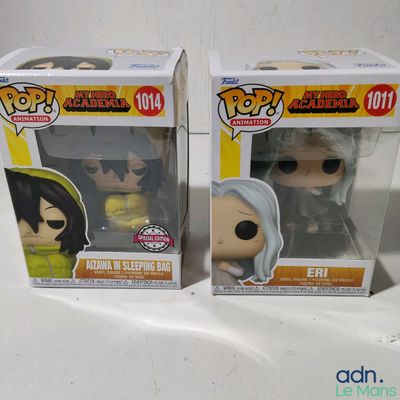 two pop vinyl figures of anime characters in boxes on a white surface