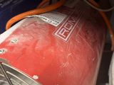 an image of a red gas can in a cabinet