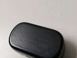 a small black object sitting on a table