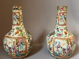 two vases sitting side by side on a table