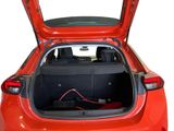 a red car with its trunk open on a white background