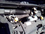 the engine of a car with its hood open and the hood open