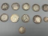 a close up of a bunch of coins sitting on top of a table