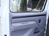a white van with the door open and the driver ' s side door open
