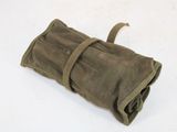 a roll of waxed canvas on a white surface