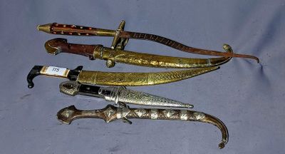 several different types of knives are lined up on a table
