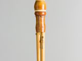 a small wooden object with a toothbrush in it