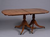 an oval dining table with two leaves on the top
