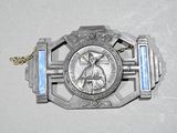 a silver medal with a picture of jesus on it