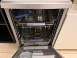 a dishwasher that is sitting on the floor