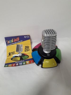 a microphone and a card on a white table