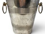 a large silver metal bucket with two handles on a white background