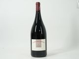 a bottle of wine that is sitting on a table