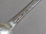 a spoon that has some writing on it