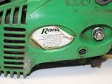a close up of a green machine on a table