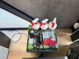 a box of items on a desk next to a laptop