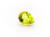 a pear shaped green peridot gems on a white background