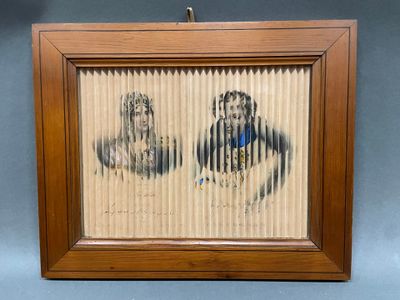 painting of a man and a woman in a wooden frame on a wall