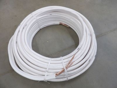 a close up of a bunch of white wires on a floor