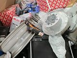 a cardboard box filled with many different types of luggage