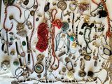 a picture of a display of various necklaces and bracelets