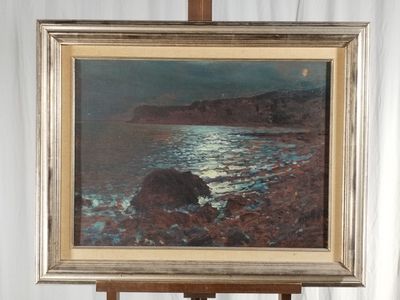 a picture of a painting on a easel by the water