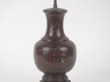 a brown vase that is sitting on a table