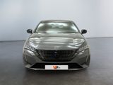 the front view of a grey car in a showroom