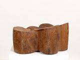 a wooden sculpture that is sitting on top of a box