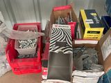 many boxes of assorted items sitting on the floor