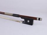 violin bow made of wood and metal on a white background