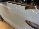 a close up of a car door handle with a sticker on it