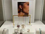 a display of jewelry on a table in a store