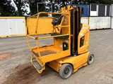an image of a forklift parked in front of a container
