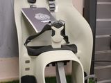 a baby seat that has a seat belt attached to it