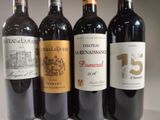 several bottles of wine are lined up on a table