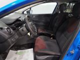 the interior of a blue car with black seats and a steering wheel