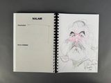 an open notebook with a drawing of a man with a beard and mustache