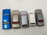 several toy cars are lined up in a row on a table