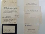 some old papers are sitting on top of a white table