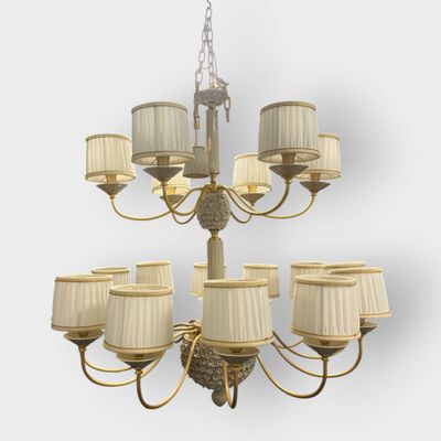 a large chandelier with twelve lamps and a chandelier shade